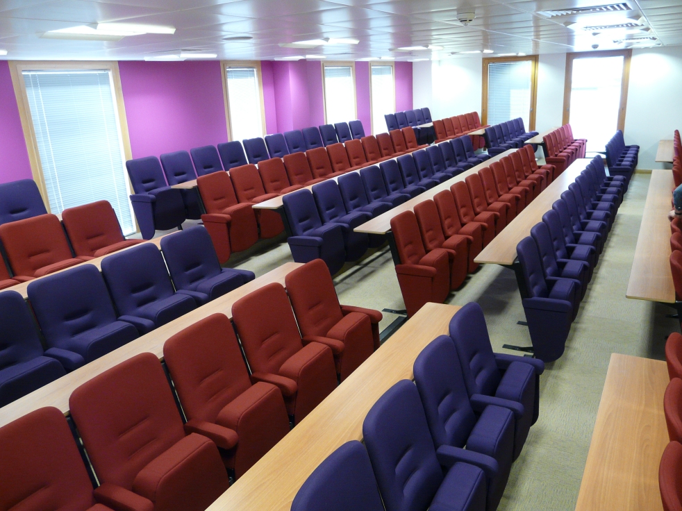5 - Lecture chairs incorporating full length fixed writing desks.JPG